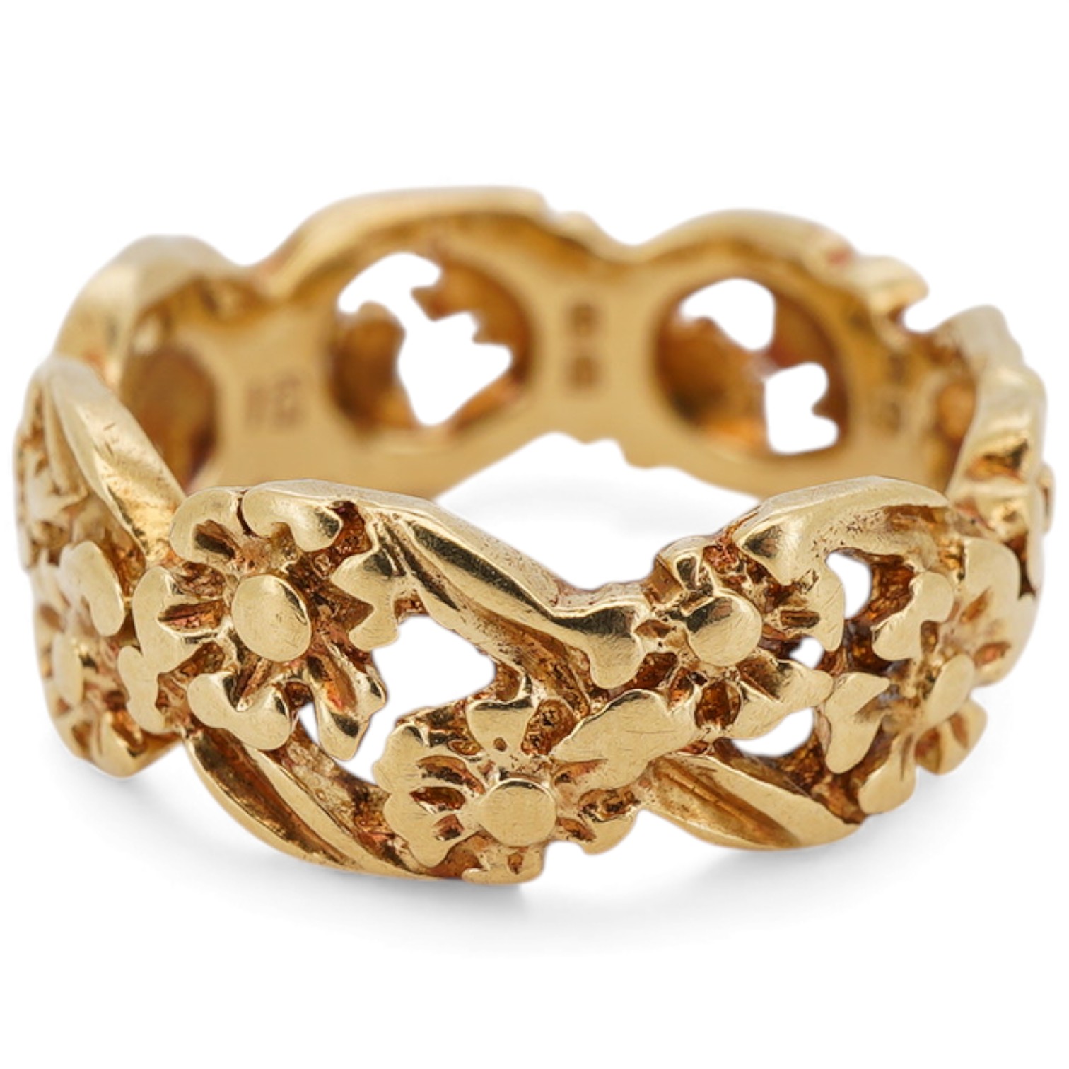 An early 1970's 18ct gold band, of pierced foliate design, maker I.G., London, 1971, size K, 5 grams.